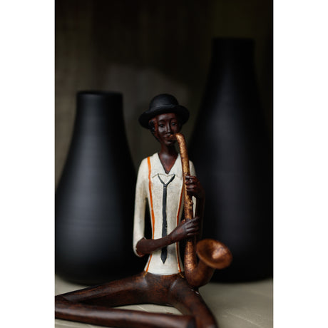 sitting jazz band saxophonist