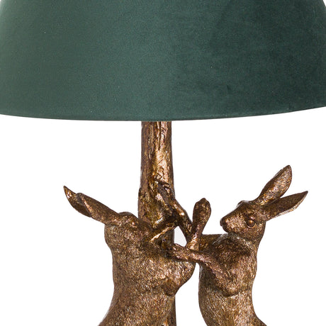 antique gold marching hares lamp with green velvet shade
