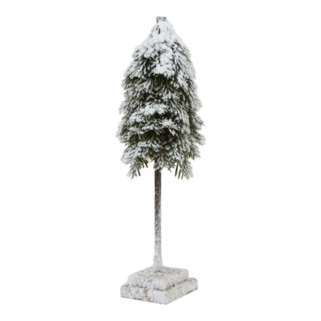 medium snowy cedar tree on wood block