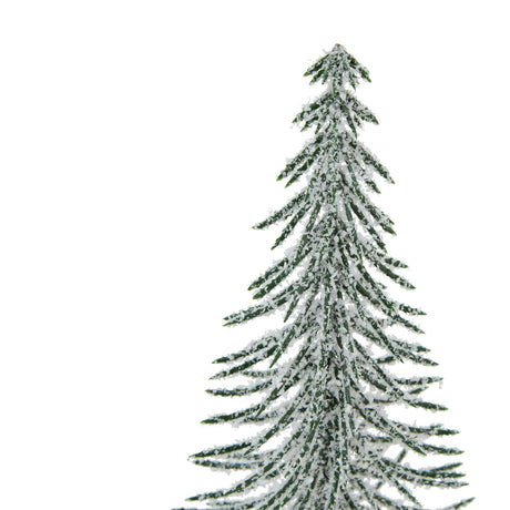 large snowy spindle tree in wood log