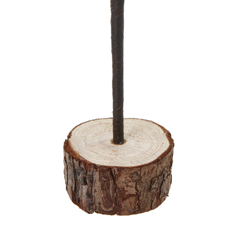 medium snowy spindle tree in wood log