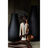 sitting jazz band saxophonist