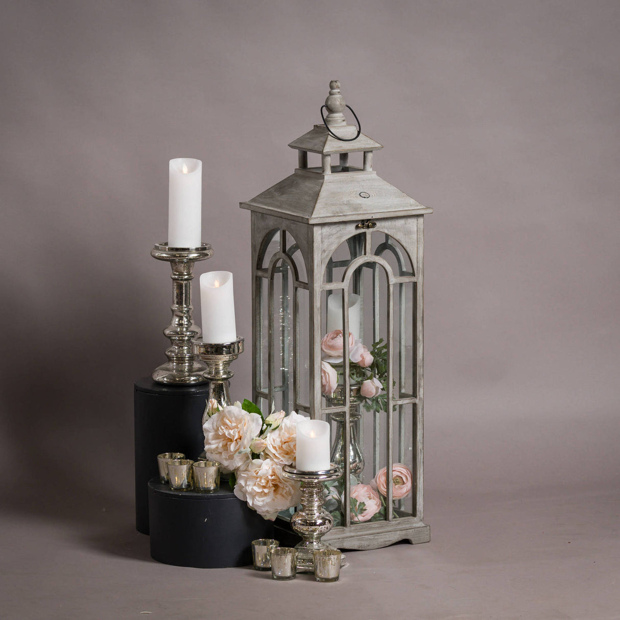 set of three wooden lanterns with archway design