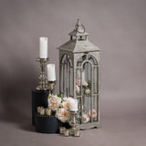 set of three wooden lanterns with archway design