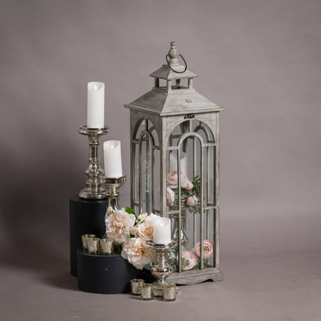 set of three wooden lanterns with archway design
