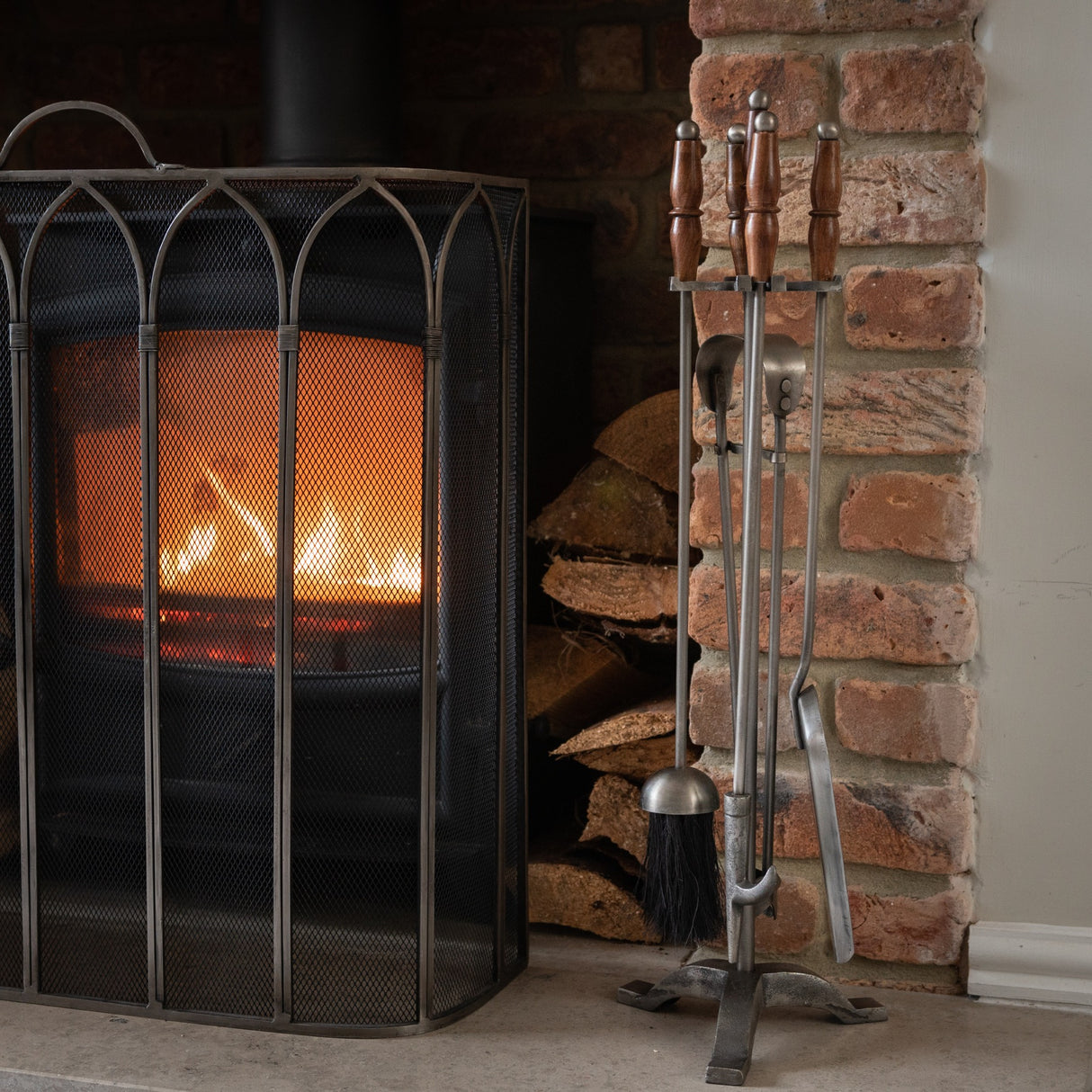 hand turned fire companion set in antique pewter with wooden handles