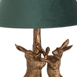 antique gold marching hares lamp with green velvet shade