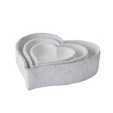 set of three large matt white ceramic dishes
