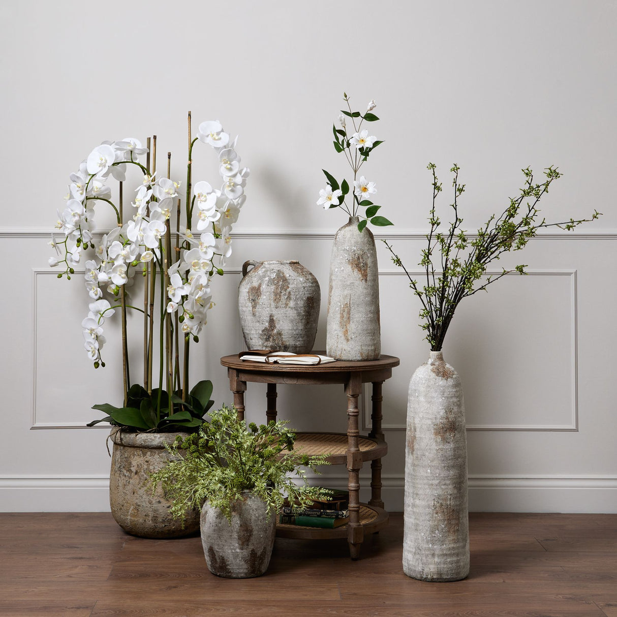 large white orchid in antique stone pot