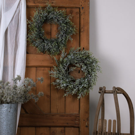 frosted pine wreath with pinecones