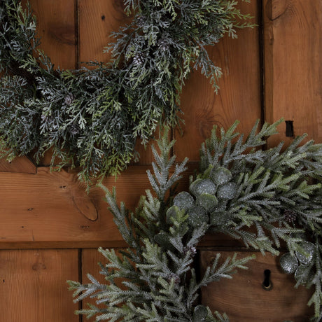 frosted pine wreath with pinecones