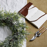 frosted pine wreath with pinecones