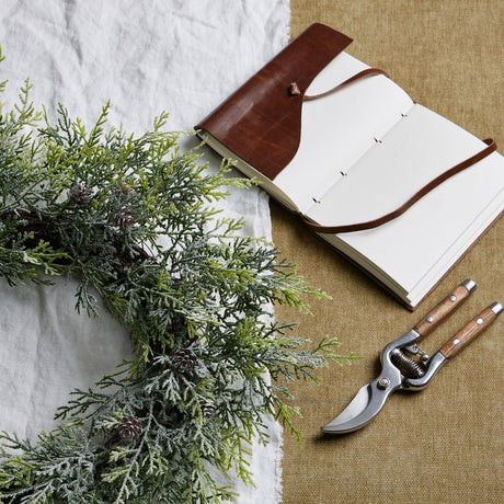 frosted pine wreath with pinecones