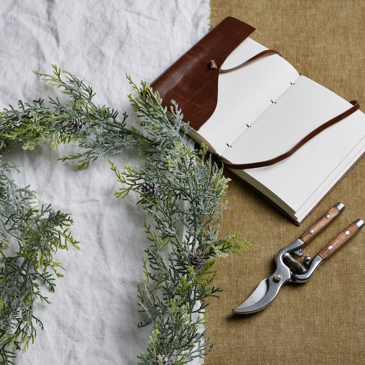 frosted pine garland with pinecones