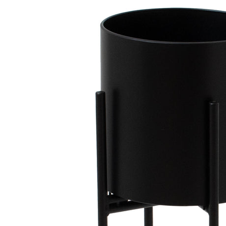 matt black cylindrical planter on black frame