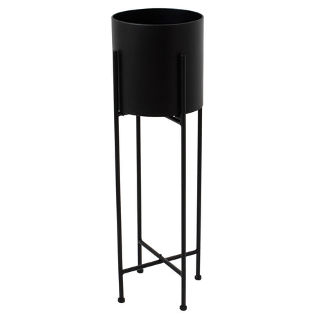 large matt black cylindrical planter on black frame