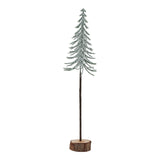 large snowy spindle tree in wood log