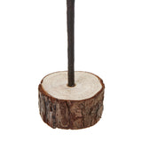 medium snowy spindle tree in wood log