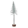 medium snowy spindle tree in wood log
