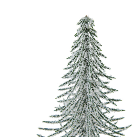 small snowy spindle tree in wood log