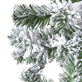 extra large snowy spruce tree