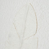 large quill white feather art mounted in beaded frame