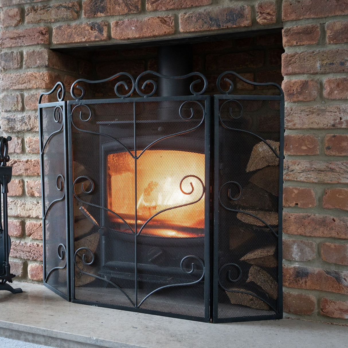 heavy large black ornate fire screen